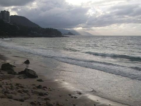 Gentle surf at Playa Palmares, south coast of Puerto Vallarta